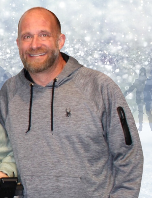 ID: this is an image of the spot lighted Peer mentor, Nate. He is smiling and wearing a Gray hoodie.