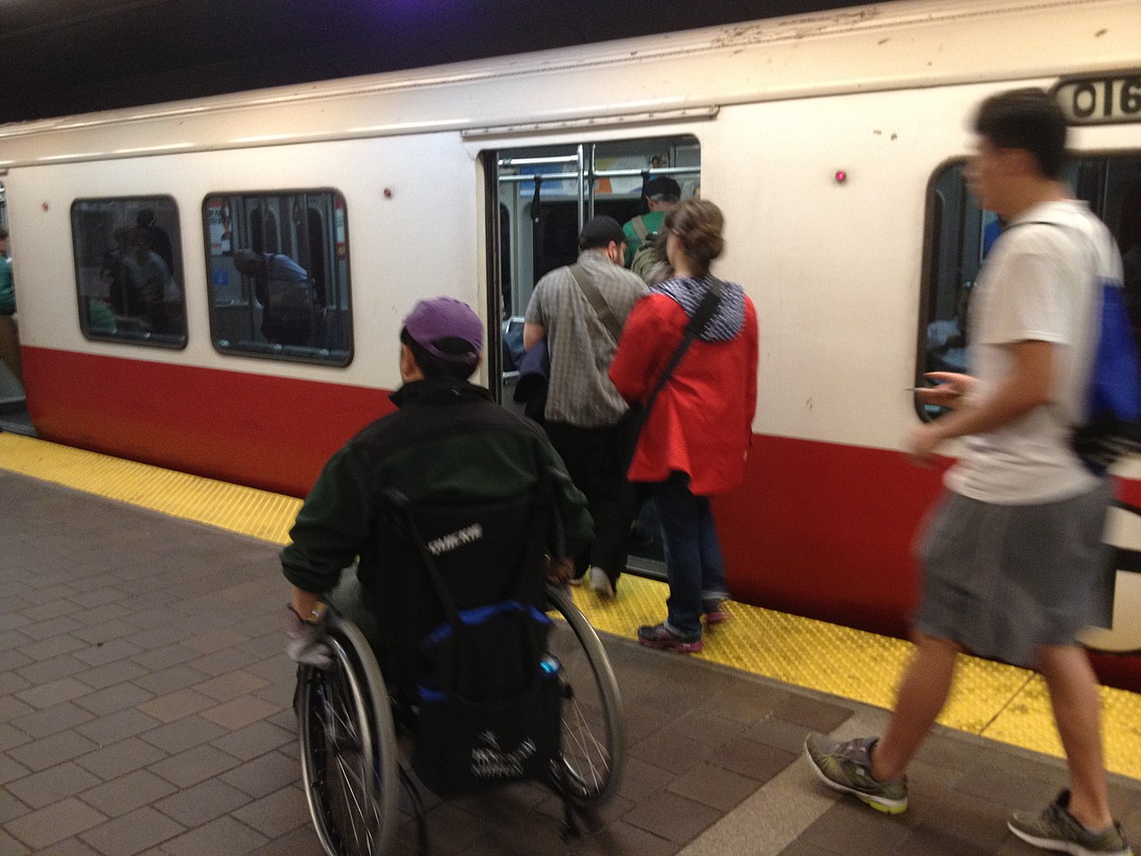 Picture of wheelchair user Rolling on to the red line.