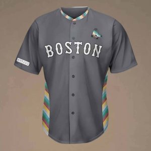 Image of Boston Red Sox disability pride jersey. Background is a brown color with a black jersey with Boston written across the chest and the colors of the disability pride flag on the sides of the jersey and color.